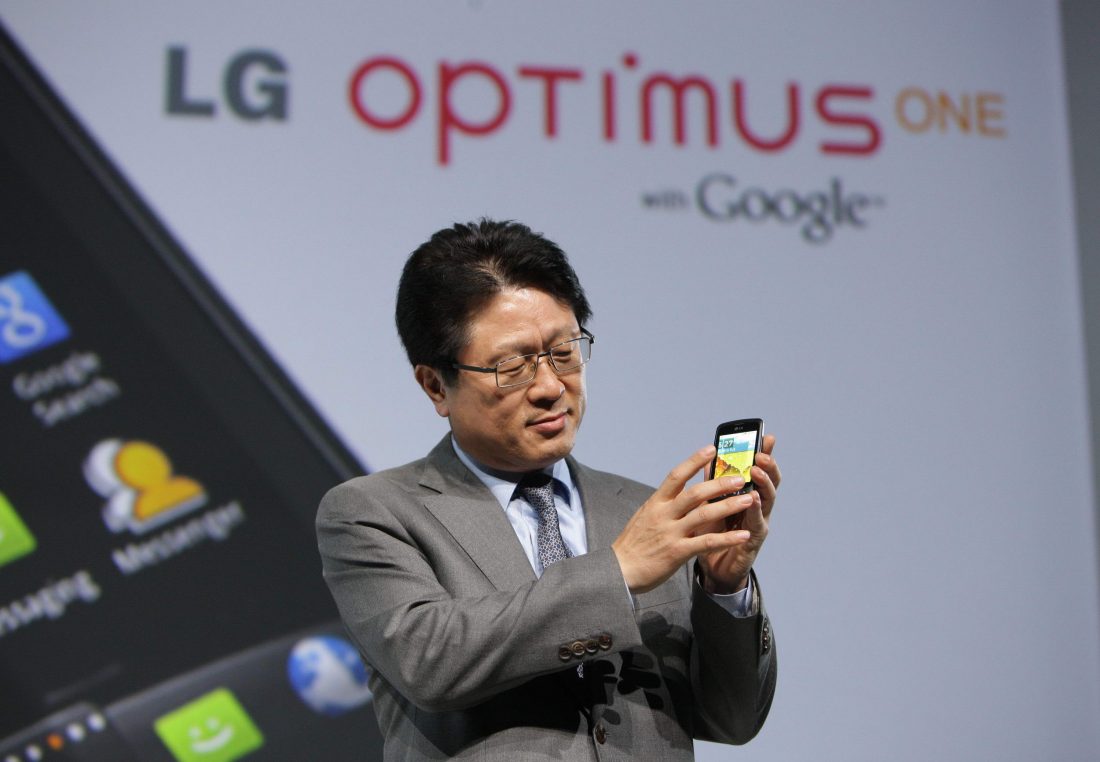 Dr. Skott Ahn, president and CEO of LG Electronics Mobile Communications Company, touches the screen of the LG Optimus One.