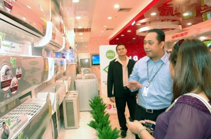 A gentleman explains how LG’s air conditioners are the healthiest on the market in front on numerous offerings from LG.