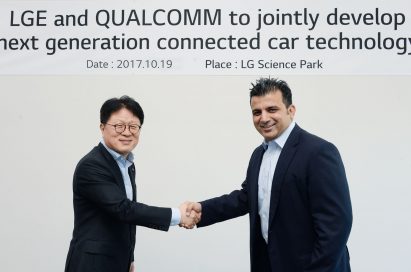 Kim Jin-yong, executive vice president of LG’s Vehicle Components Smart Business Unit, shake hands with Nakul Duggal, vice president of product management at Qualcomm Technologies, Inc, to celebrate the new agreement