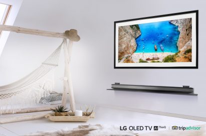 LG SIGNATURE OLED TV W in a room with a hammock displaying an image of boats on the coast of a rocky island.