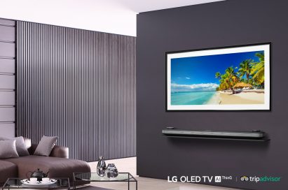 LG SIGNATURE OLED TV W in a modern-designed living room displays the tropical beach with coconut trees on its screen.