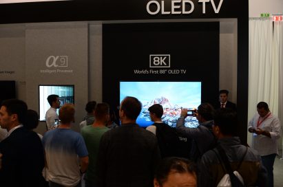 World’s First 8K OLED TV with A9 Intelligent Processor display zone at IFA 2018 with conference attendees walking around and looking at the display