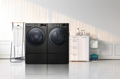 LG TWINWash™ washing machine and dryer in a laundry room