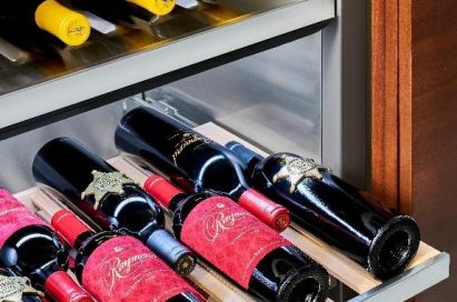 A look inside the Signature Kitchen Suite lineup’s wine cellar, which is full of wine bottles.
