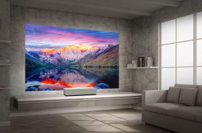 A view of LG CineBeam 4K UHD projector model HU85L producing incredible natural landscapes in a modern, low-lit living room